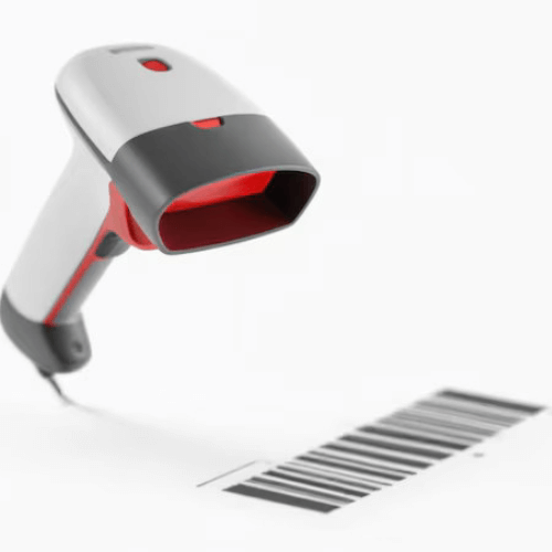 A handheld barcode scanner scanning a barcode on a white surface.