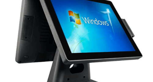 A sleek black POS system with a touchscreen displaying the Windows 7 interface, designed for retail and business operations.