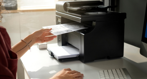 Person using a receipt printer.