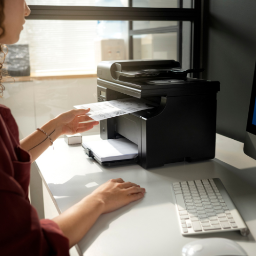 Person using a receipt printer.