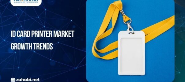 Close-up of an ID card printer producing badges with an upward market chart overlay.